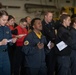 U.S. Sailors attend an Easter sunrise service aboard the aircraft carrier USS John C. Stennis (CVN 74)