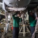U.S. Sailors reconnect main landing gear doors