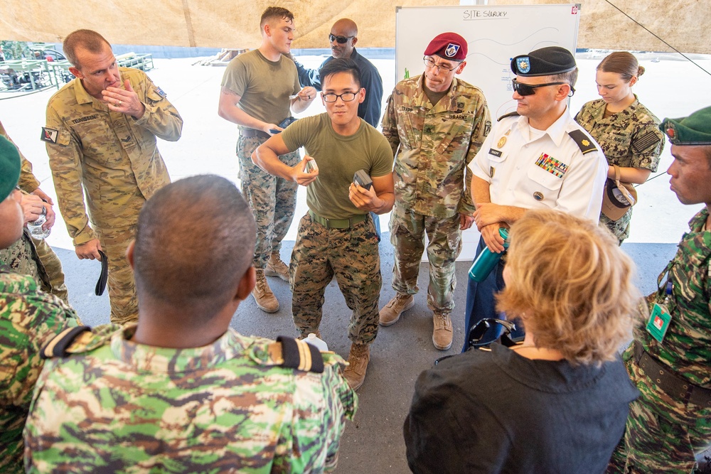 Pacific Partnership 2019 Personnel Discuss Water Purification with Ambassador