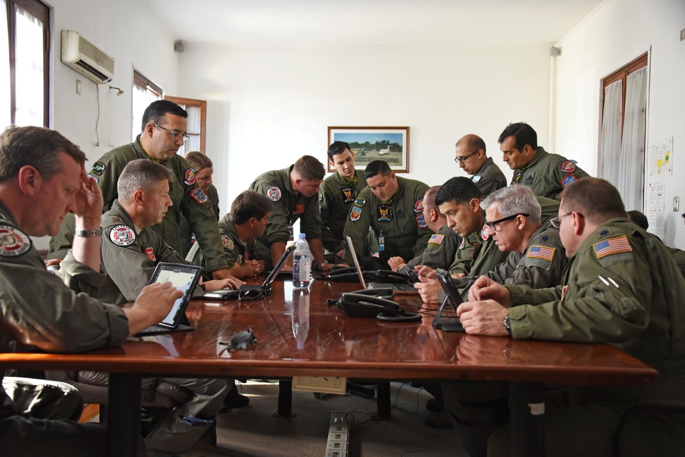 U.S. Air Force Airman and Argentine Air Force Military members partnered up in a joint review of local flight routes