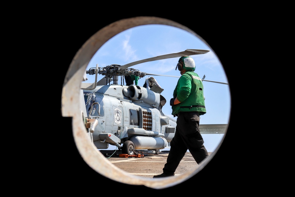 Helicopter Maritime Strike Squadron (HSM) 37, Detachment ONE, perform maintenance on an MH-60R Seahawk