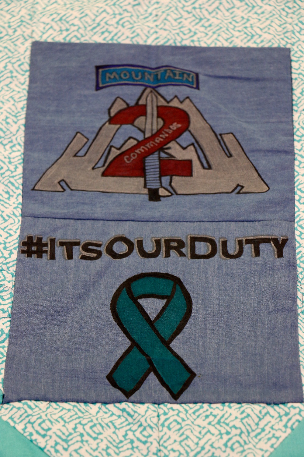 Commando leaders wear teal for Denim Day observance