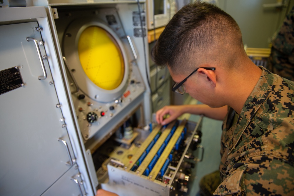 U.S. Marines perform maintenance on the AN-FPN-63(V) radar
