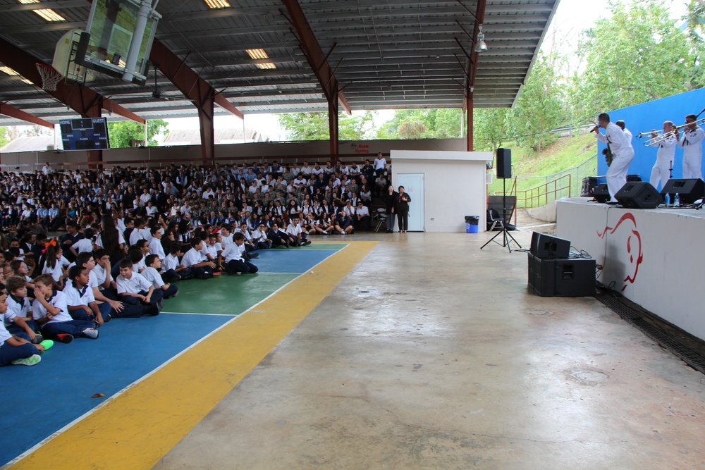 Sailors from the Popular Music Group from Navy Band Southeast perform for students at the American Military Academy in Bayamón as a part of Navy Week Puerto Rico.