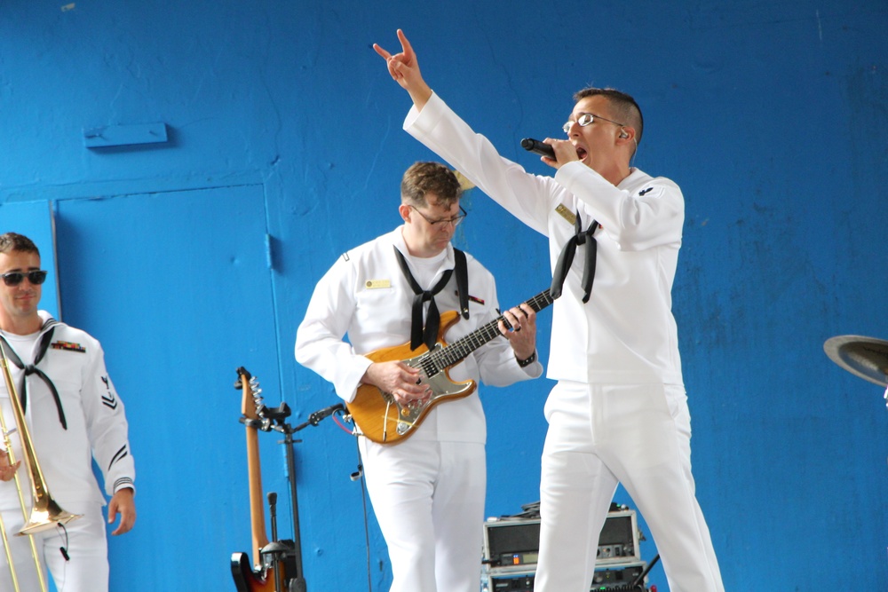 Sailors from the Popular Music Group from Navy Band Southeast perform for students at the American Military Academy in Bayamón as a part of Navy Week Puerto Rico.