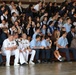 Sailors from the USS San Juan (SSN 571) watch a band performance with students at the American Military Academy in Bayamón as a part of Navy Week Puerto Rico.