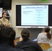 Lt. Cmdr. Katiana Cruet talks to students about the dental corps at Antilles High School on Fort Buchanan as a part of Navy Week Puerto Rico.