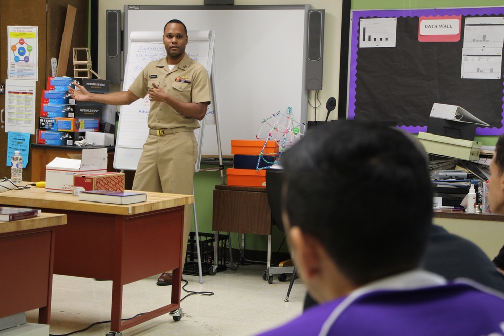 Lt. Karlton Mitchell talks to students about his career at Antilles High School on Fort Buchanan as a part of Navy Week Puerto Rico.
