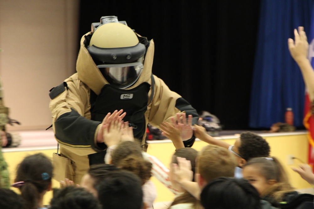 Explosive Ordnance Disposal Technician 3rd Class Ryan Miller from Explosive Ordnance Group 2 engaged students from students from Antilles Middle School on Fort Buchanan as a part of Navy Week Puerto Rico.