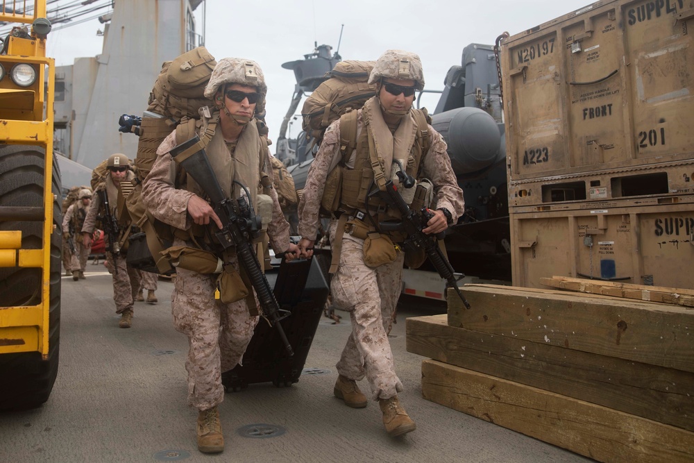 Marines depart the USS Fort McHenry