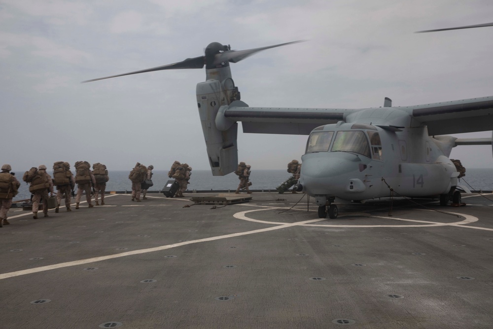 Marines depart the USS Fort McHenry