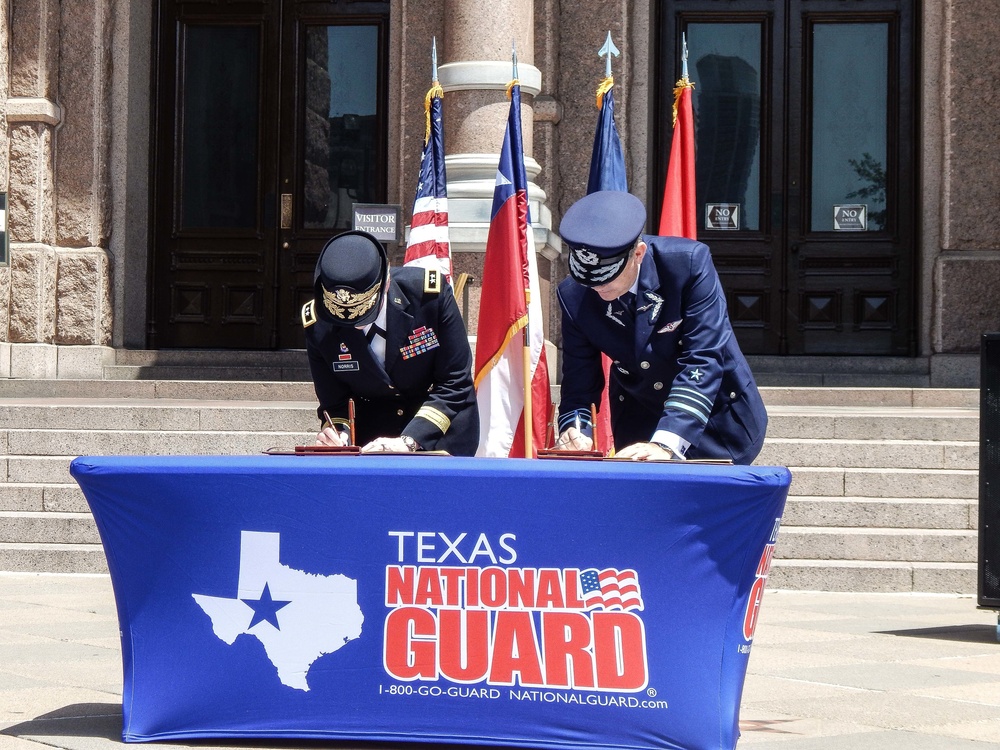 Maj. Gen. Tracy Norris with Chilean Military officials signing the proclamation