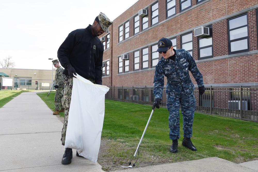 Sailors participate in a base clean-up