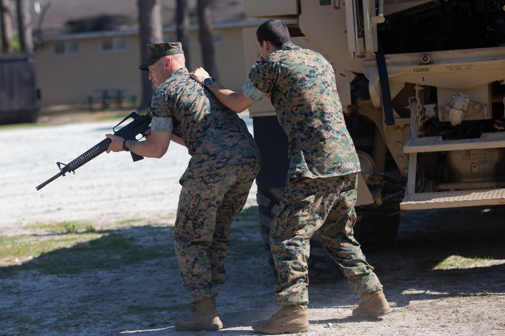 Religious program specialists train in combat skills