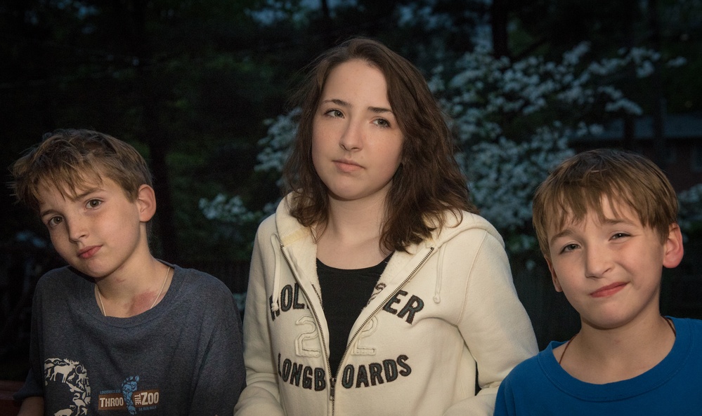 Military youths pose to demonstrate lighting techniques.