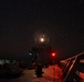 Bertholf sails under a night sky in the South China Sea
