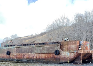 Coast Guard, contractors respond to derelict barge on Kodiak Island, Alaska