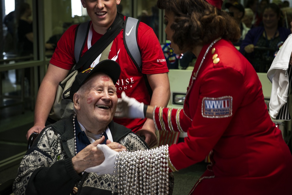 Military members and Victory Belles welcome veterans in New Orleans