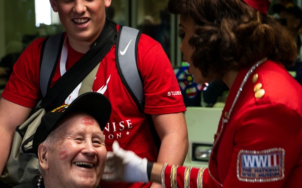 Military members and Victory Belles welcome veterans in New Orleans