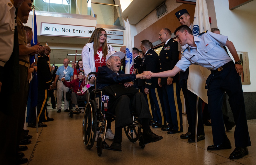 Military members and Victory Belles welcome veterans in New Orleans