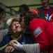 Military members and Victory Belles welcome veterans in New Orleans