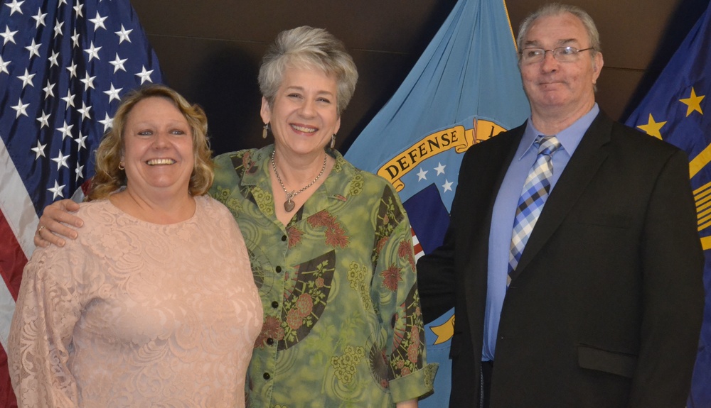 Susanne McHale, Susan Paul and Michael Newell, pictured left to right, pose after a retirement ceremony in their honor at DLA Troop Support in Philadelphia April 25, 2019.