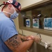 Hospital Corpsman scrubs in for surgery at Naval Hospital Camp Pendleton