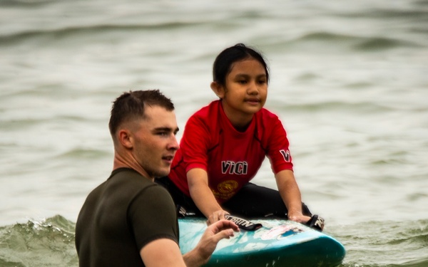 U.S. Marines participate in a swim survival COMREL event