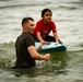 U.S. Marines participate in a swim survival COMREL event