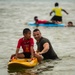 U.S. Marines participate in a swim survival COMREL event