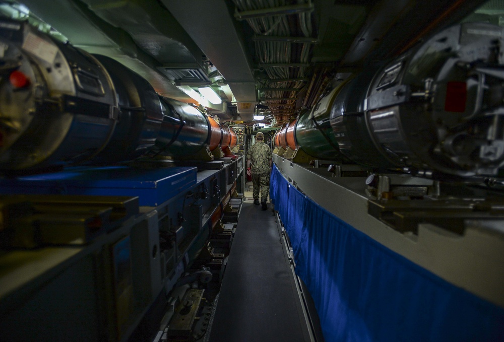 USS Albany (SSN 753) Sailor Walks through Missile Room