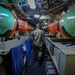 USS Albany (SSN 753) Sailor Walks through Missile Room