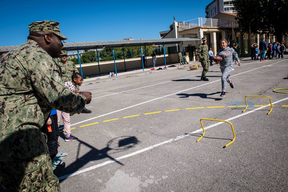 U.S. Sailors assigned to the John C. Stennis Carrier Strike Group (JCSCSG) volunteer at the Saint-Louis Primary School