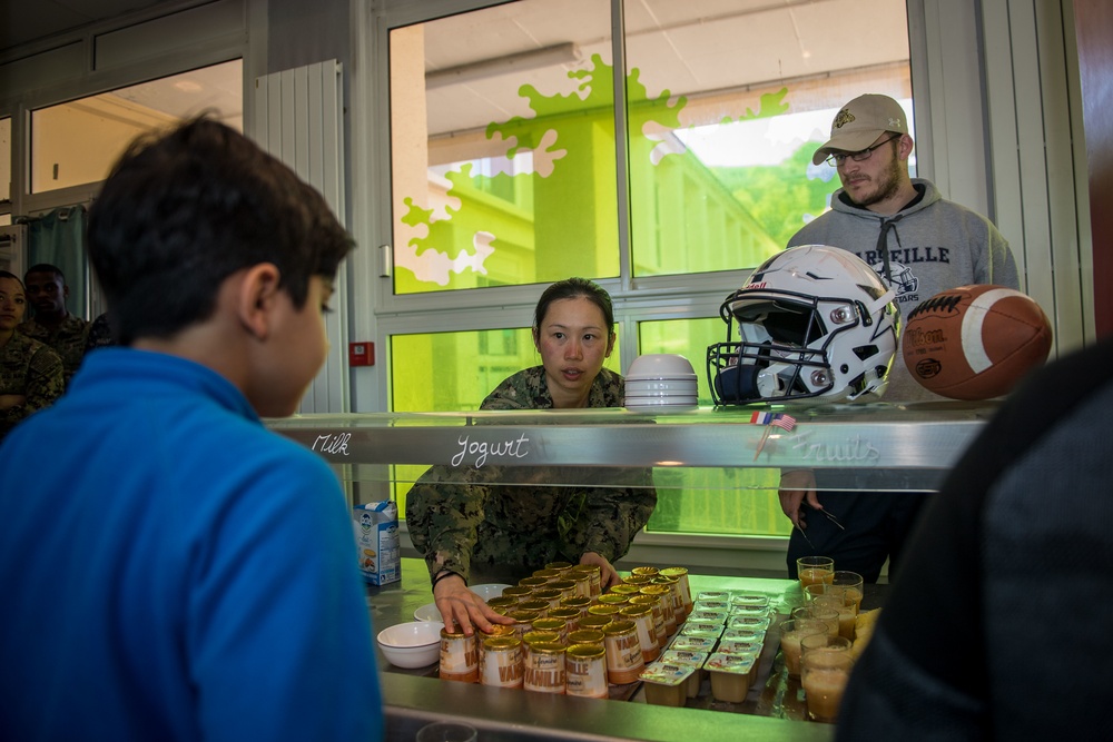 U.S. Sailors assigned to the John C. Stennis Carrier Strike Group (JCSCSG) volunteer at the Saint-Louis Primary School