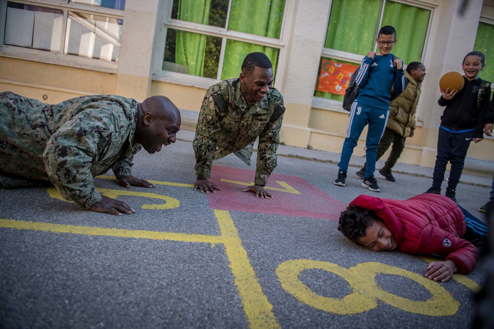 U.S. Sailors assigned to the John C. Stennis Carrier Strike Group (JCSCSG) volunteer at the Saint-Louis Primary School