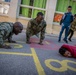 U.S. Sailors assigned to the John C. Stennis Carrier Strike Group (JCSCSG) volunteer at the Saint-Louis Primary School