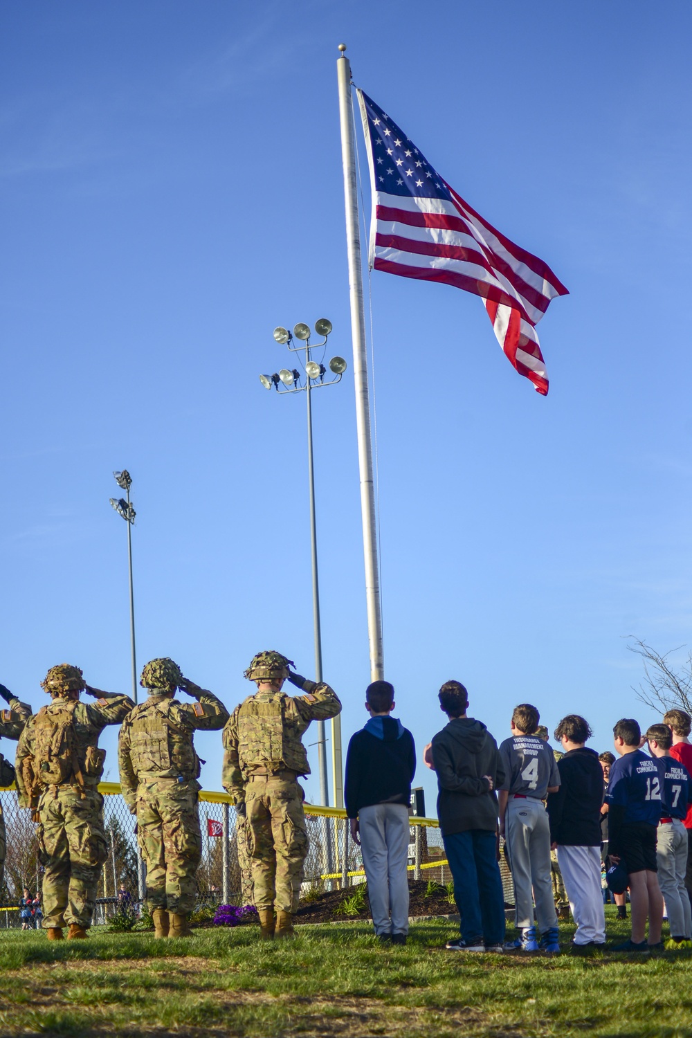 Soldiers raise flag for youth baseball