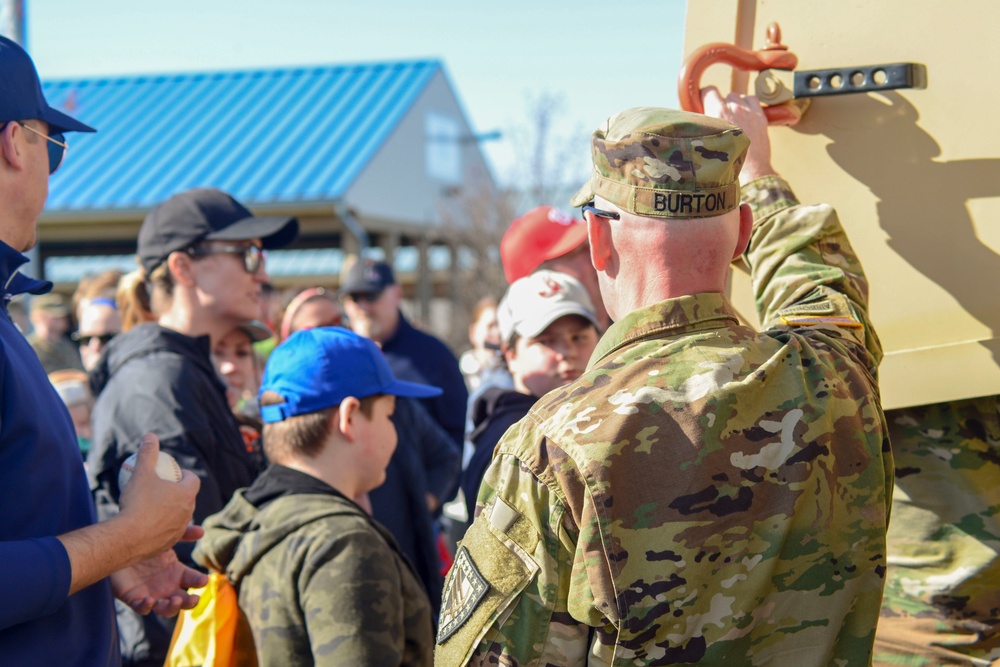 Soldiers raise flag for tour baseball