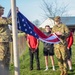 Soldiers raise flag at youth baseball game