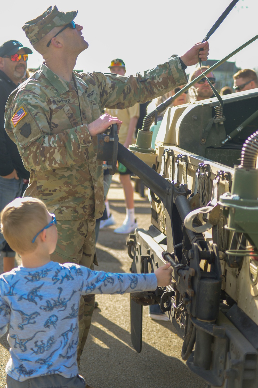 Soldiers raise flag at youth baseball game