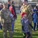 Soldiers raise flag at youth baseball game
