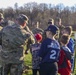 Soldiers raise flag for youth baseball game