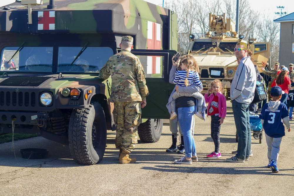 Soldiers raise flag for youth baseball game