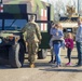 Soldiers raise flag for youth baseball game