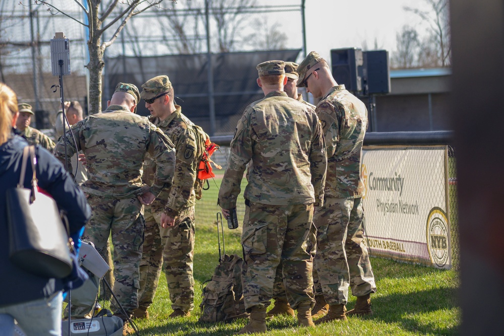 Soldiers raise flag for youth baseball