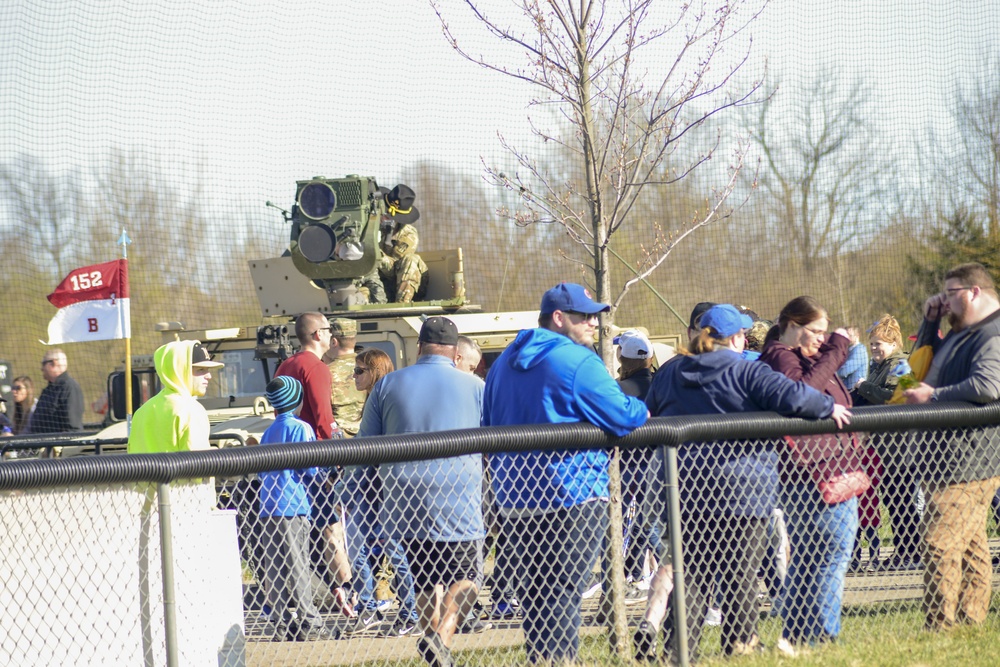 Soldiers raise flag at youth baseball game