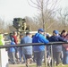 Soldiers raise flag at youth baseball game