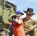 Soldiers raise flag at youth baseball game