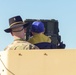 Soldiers raise flag at youth baseball game