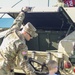 Soldiers raise flag at youth baseball game